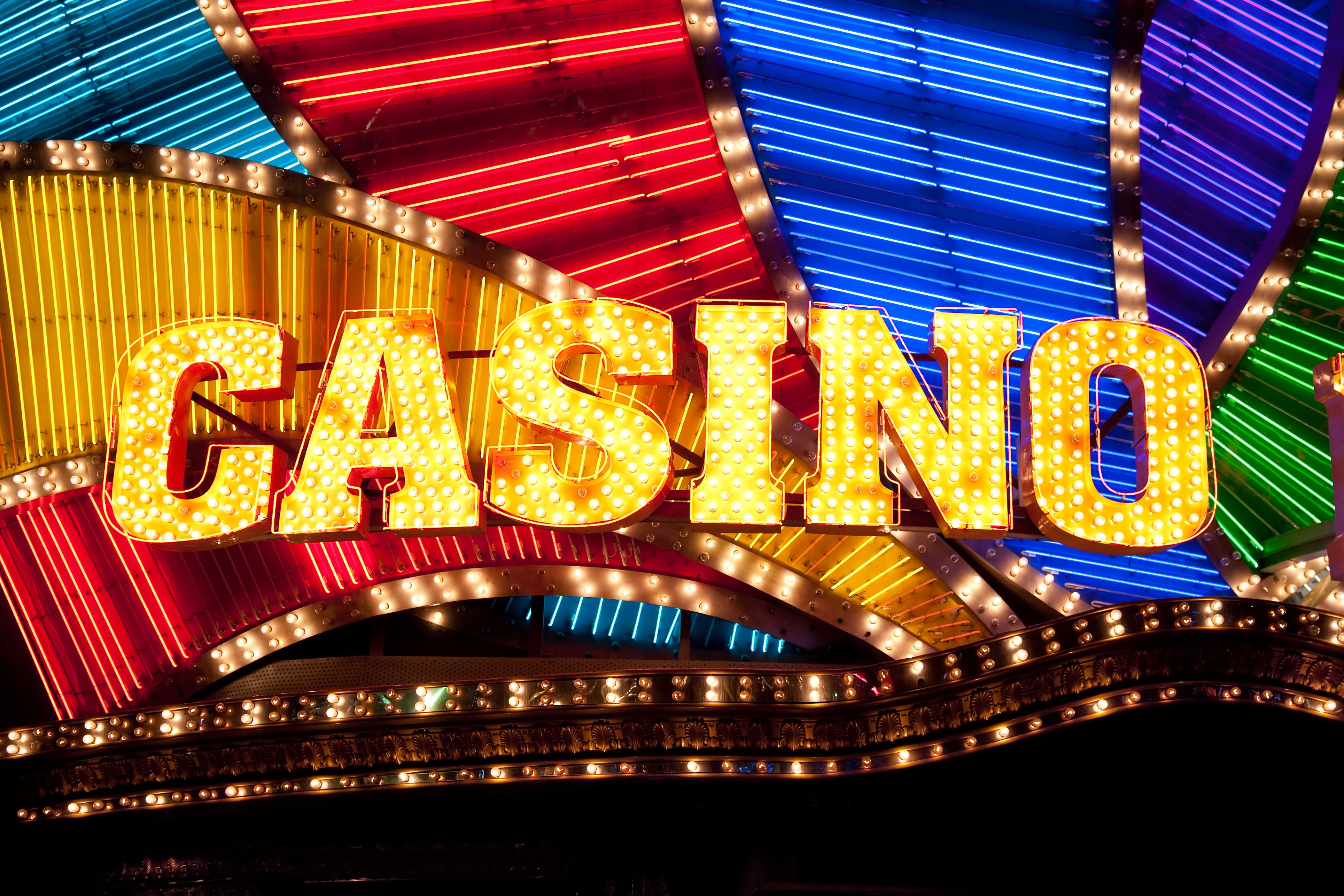 A vibrant graphic showcasing the DoubleDown Casino logo with a cascade of gold coins and diamonds.